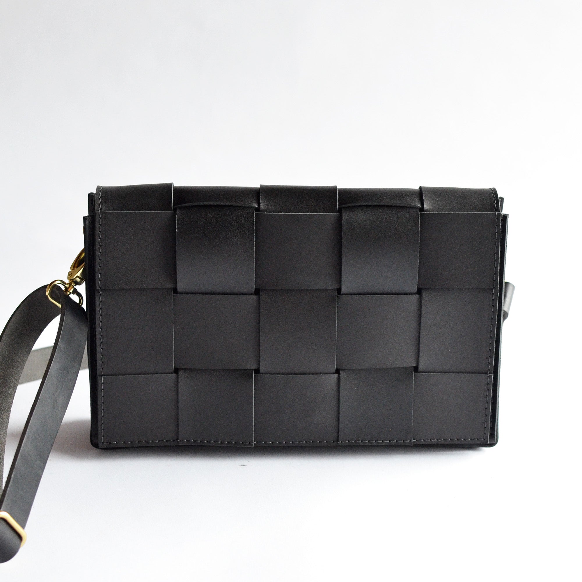 Black woven clutch bag hotsell